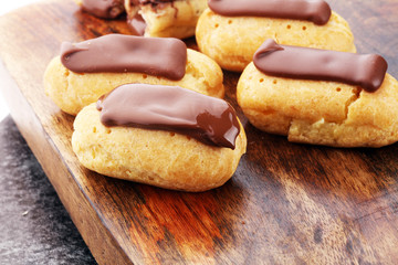 Traditional French dessert. Eclair with chocolate icing. Pastery concept