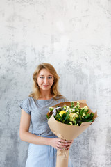 Long-haired florist on empty background