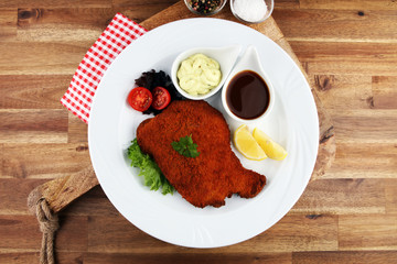 Homemade Breaded German Weiner Schnitzel on white dish