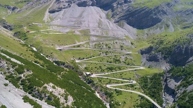 Aerial 4K - Stelvio National Park - Valle del Braulio - Vista della strada e tornanti salendo da Bormio