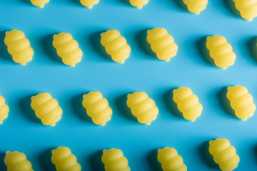 Gnocchi pasta pattern on a blue background