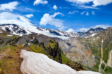 Fototapeta na wymiar A beautiful mountain landscape. View of the highest peak of Europe - Mount Elbrus and the Glacier Gara Bashi