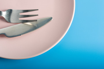 Fork and Knife on pink plate