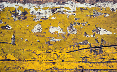 Naklejka premium Old painted in green yellow and white board with peeling paint and nails