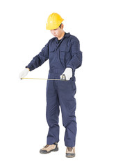 Young worker in unifrom with tape measure on white