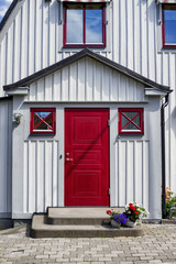 Old red entrance door in Sweden. Swedish traditional village. Scandinavia, Europe. © bzzup