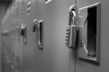 Closeup padlock with key number hanging on locker for concept technology data log security on black...