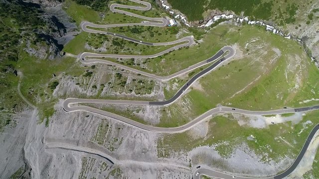 Aerial 4K - Stelvio National Park - Valle del Braulio - Vista della strada e tornanti salendo da Bormio