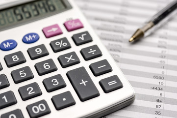 Close up shot of a calculator on top of sheets with numbers