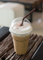 Iced coffee with caramel syrup and whipped cream