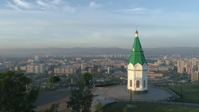 Church of Paraskeva Pyatnitsa is symbol of Krasnoyarsk. City in Siberia, Russia. Russian old architecture. Aerial drone flight around. 4K format