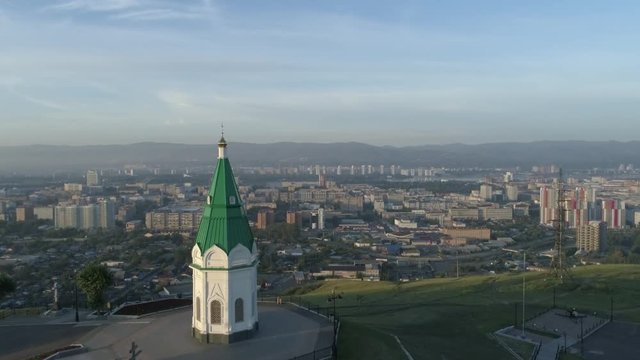 Church of Paraskeva Pyatnitsa is symbol of Krasnoyarsk. City in Siberia, Russia. Russian old architecture. Aerial drone flight around. 4K format