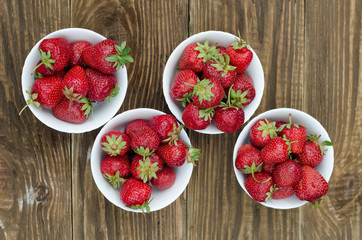 Strawberries ripe red on wooden table