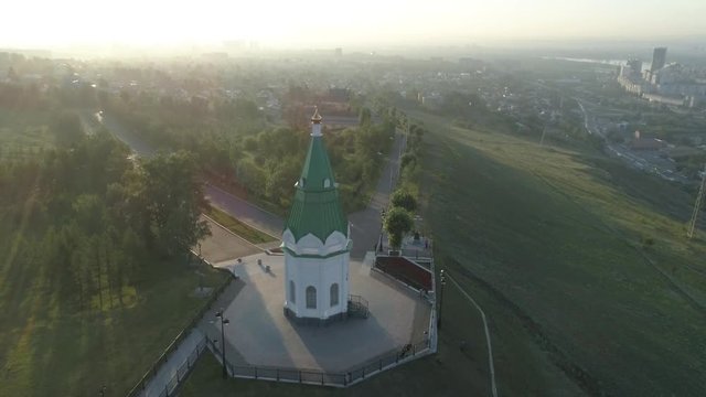 Church of Paraskeva Pyatnitsa is symbol of Krasnoyarsk. City in Siberia, Russia. Russian old architecture. Aerial drone flight around. 4K format