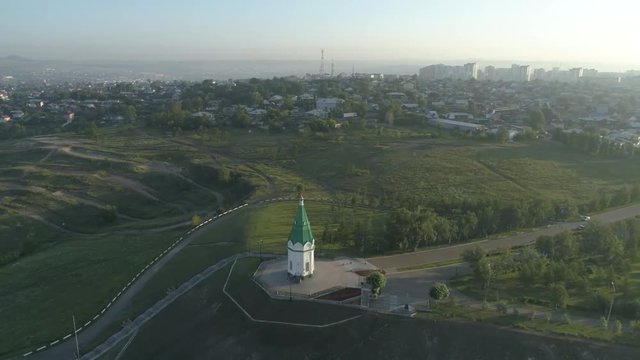 Church of Paraskeva Pyatnitsa is symbol of Krasnoyarsk. City in Siberia, Russia. Russian old architecture. Aerial drone flight around. 4K format