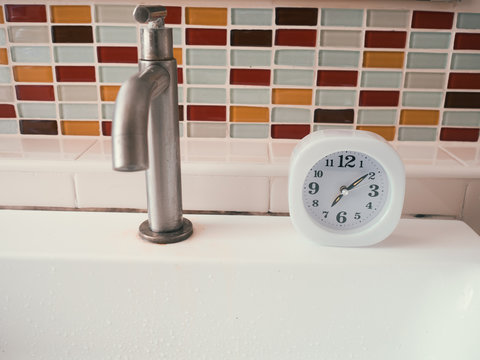 Concept Of Life Routine With Clock In The Bathroom.