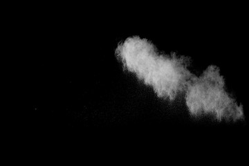 Abstract design of white powder cloud against dark background