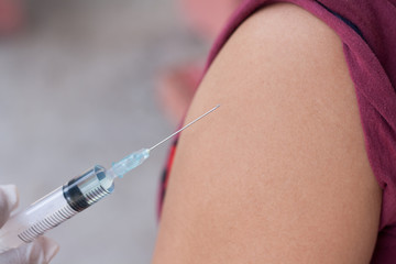 Concept vaccination. Doctors are injected to the patient.