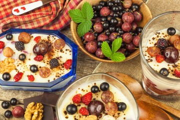Vanilla pudding with summer fruit on a wooden table. Healthy snacking for kids.
