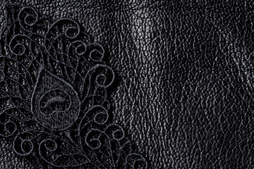 Detail of black lace on leather - obrazy, fototapety, plakaty