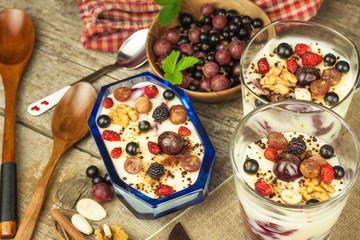 Vanilla pudding with summer fruit on a wooden table. Healthy snacking for kids.