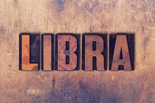 Libra Theme Letterpress Word on Wood Background