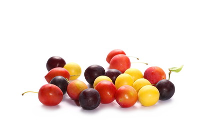 Wild plums with leaves and twigs, ringlov, isolated on white background