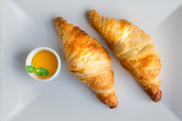 French breakfast - croissants and honey. Closeup.Top view.