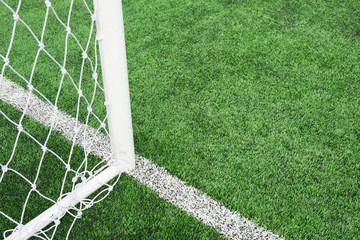close up of mesh football goal with Artificial turf on  for sport background.