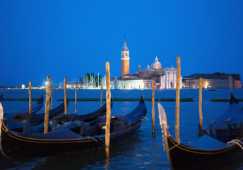Fototapeta na wymiar gondolal at night and San Giorgio Maggiore church, San Marco, Venice, Italy