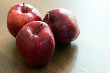 Three red apples