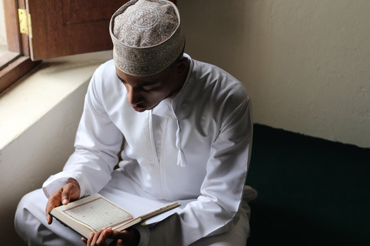 Young man reading the Quran