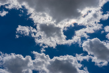 Dark blue sky with cumulus over Ukrainian land in June