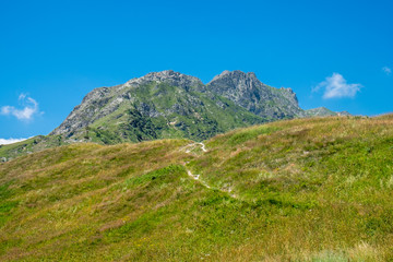 Naklejka premium Mountain peaks and meadows in Grana Valley, Cuneo, Piedmont, Italy.