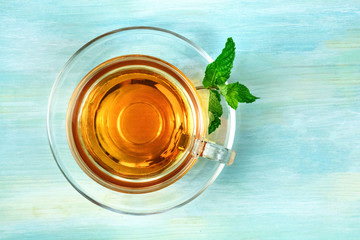 Cup of tea with mint leaf and copy space