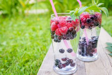 refreshing summer drink with sparkling water and fresh berries