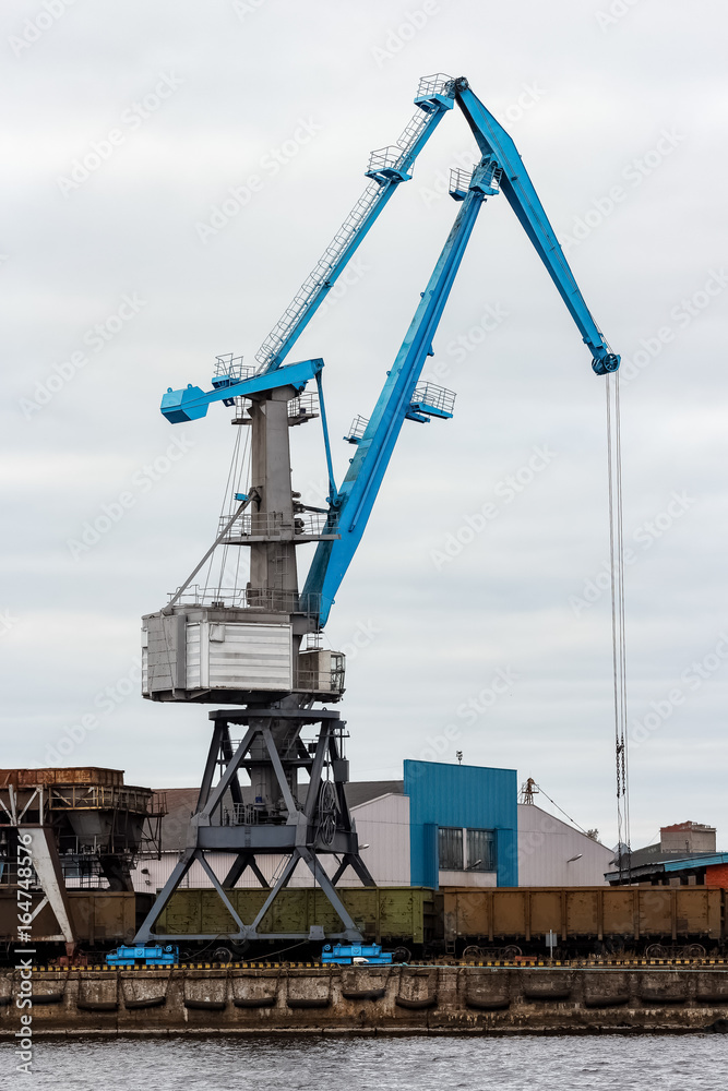 Wall mural Cargo crane in the port