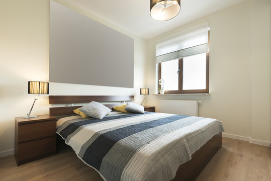 Modern bedroom in beige finishing