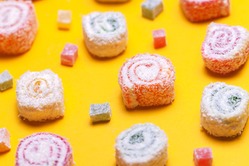 Assortment of Turkish Delight on yellow background