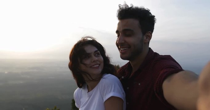 Couple On Mountain Top Taking Selfie Photo At Sunrise, Hispanic Man And Woman Happy Smiling Slow Motion 60