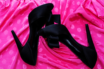 female black high heels over pink