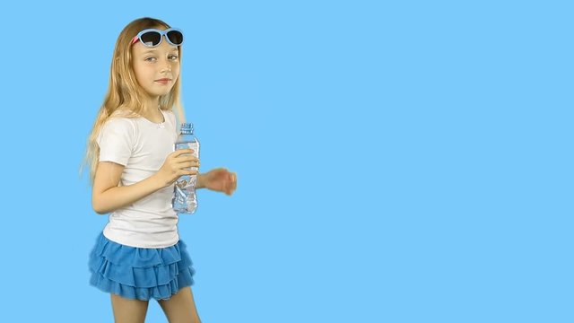 Young girl in white t-shirts drinking clear water from bottle and show thumbs up. Happy girl drink fresh water joyful summer time. Clip with Premultiplied matted Alpha Channel. Transparent BG PNG.