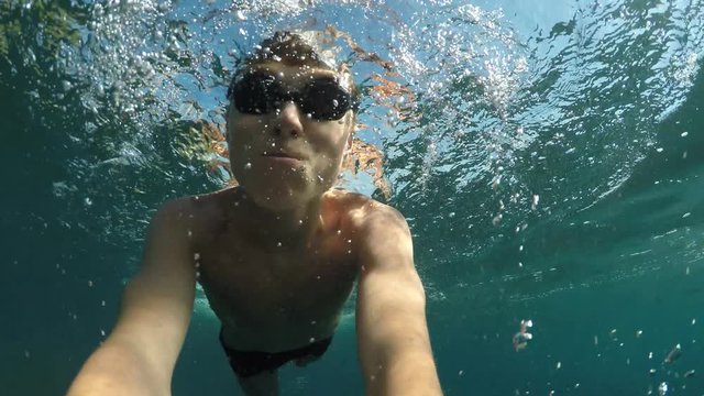 swimmer shoot himself at the camera