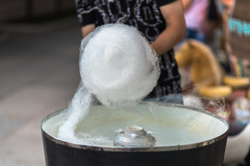 Fototapeta na wymiar The process of making cotton candy, close-up