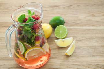 detox water with raspberries, lime, mint for weightloss closeup