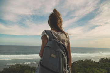 Fototapeta premium Tourist girl with backpack enjoying the view.