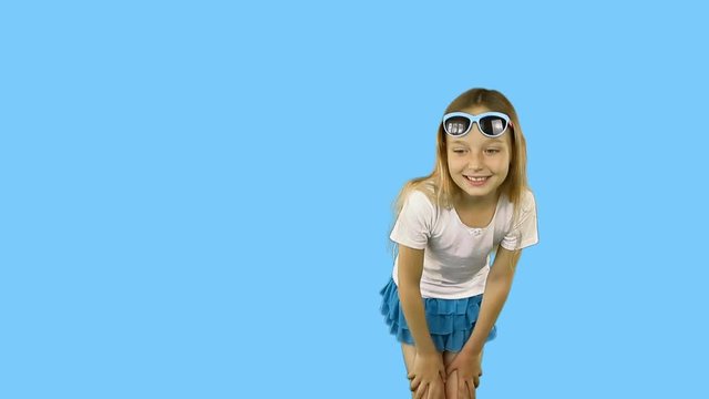 Little girl is showing her finger and dancing.. Girl in sunglasses and a T-shirt. Clip with Premultiplied matted Alpha Channel. Transparent background PNG format. Include slow motion part.