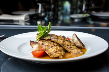 Grilled chicken fillet with french fries and asparagus