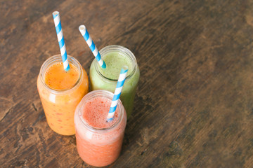 Fresh Juices Smoothie Three Jar made Red Green Orange Fruits Water Melon Strawberry Apple Kiwi Grapes Pomegranate Passion Dragon Fruit Tropical Selective focus