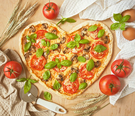 Pizza in the shape of a heart.